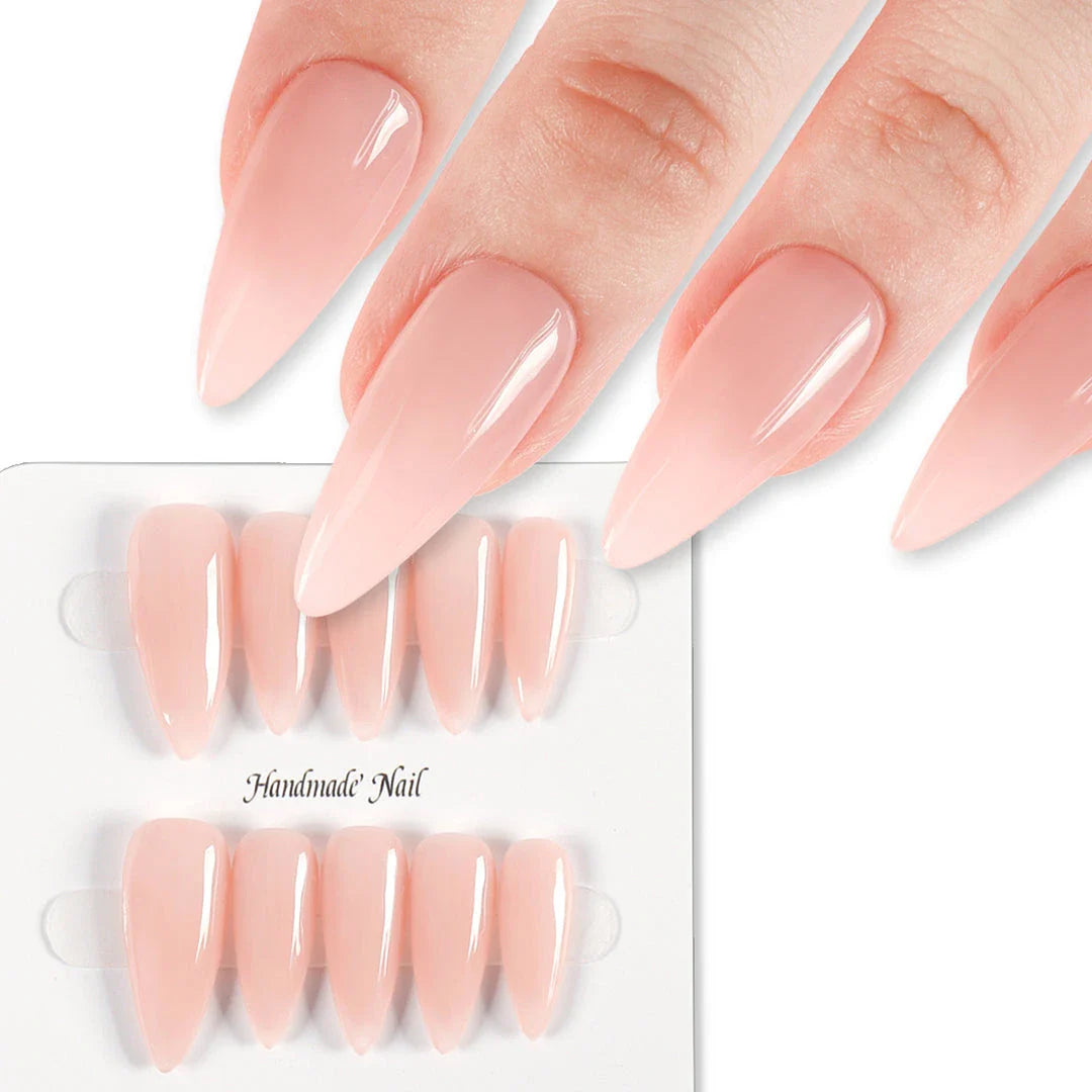 Handcrafted nude pink press-on nails with an almond shape, offering a minimalist and sophisticated style