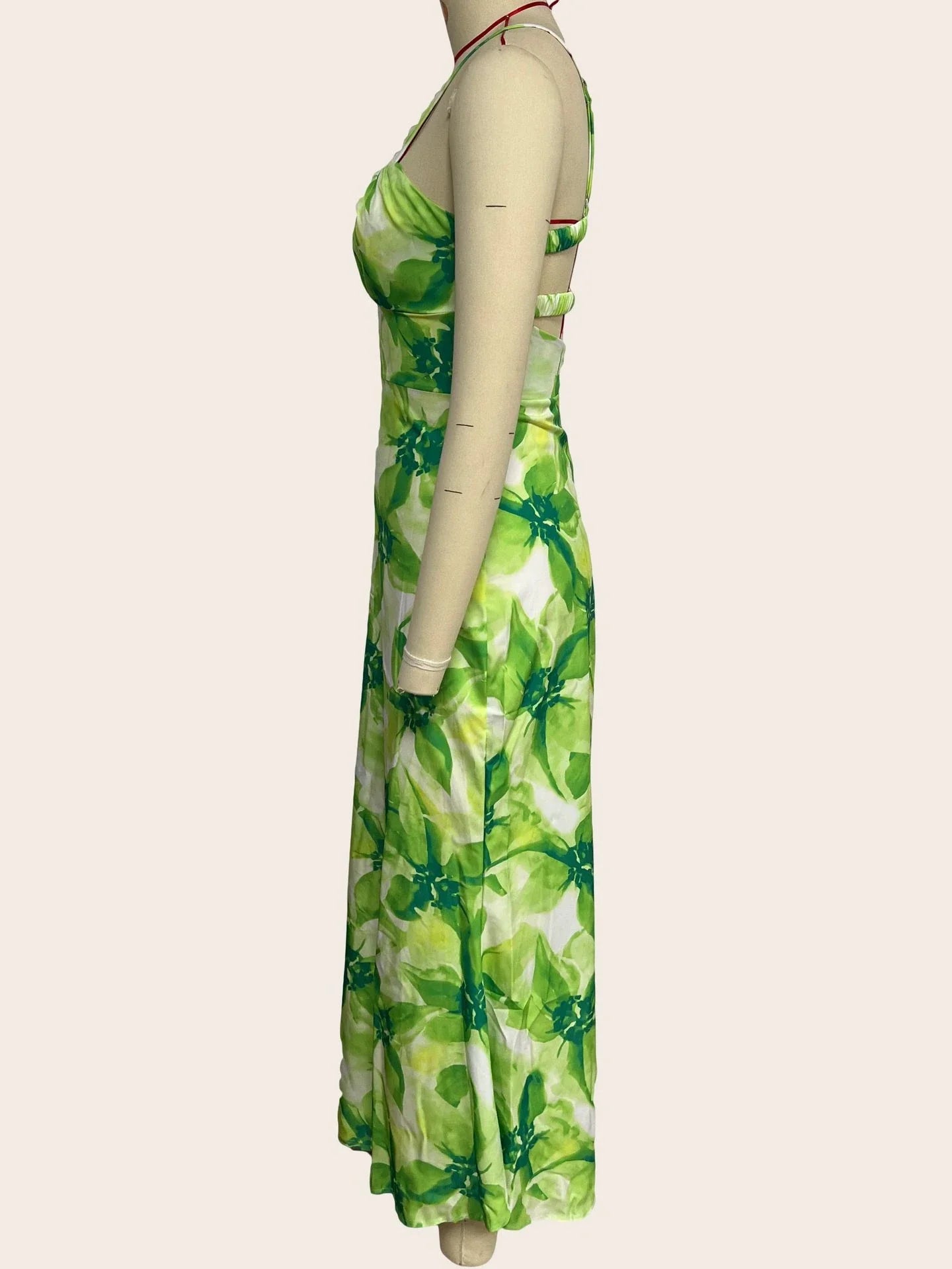 Stylish sleeveless backless midi dress with a vibrant floral print, perfect for any occasion