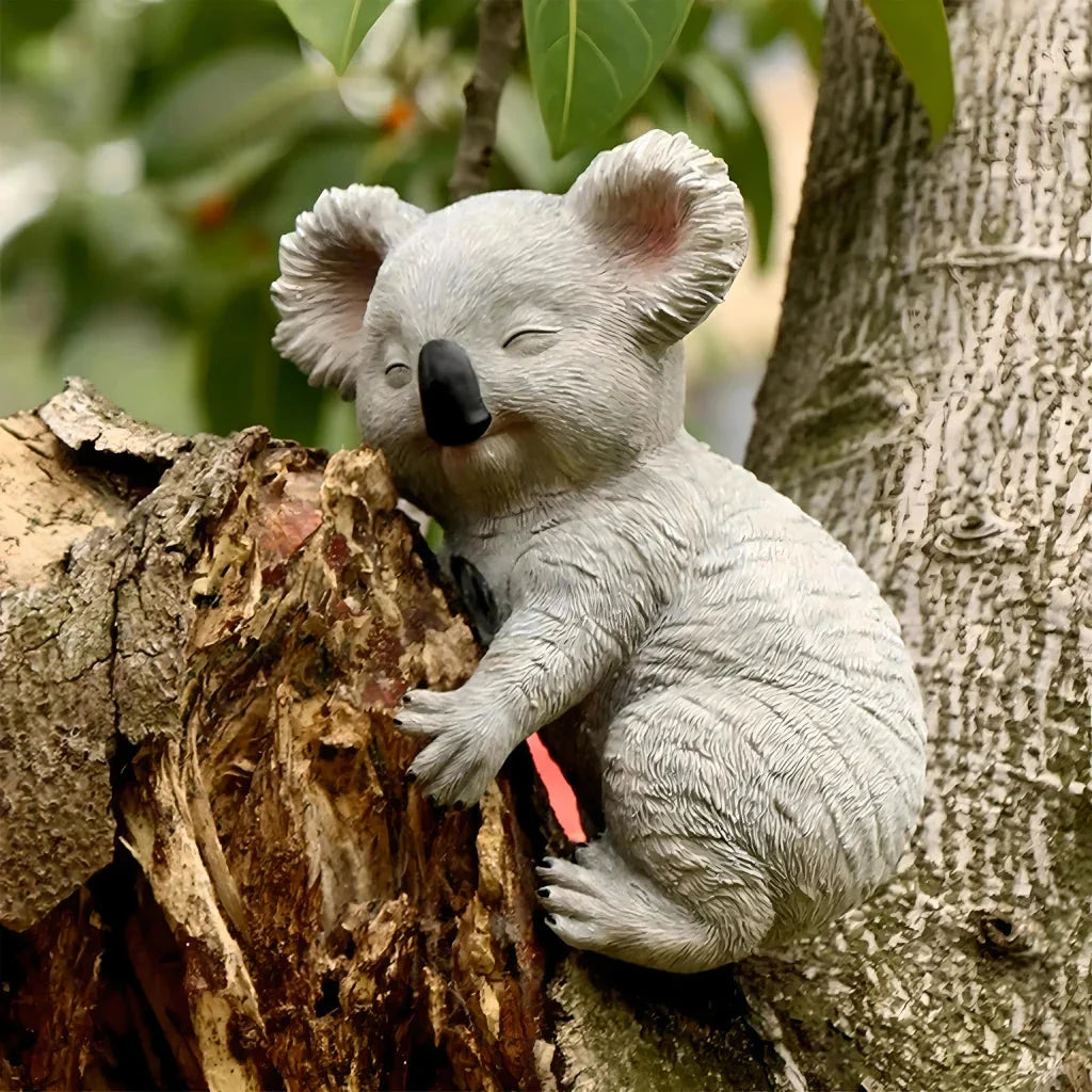 A charming and realistic outdoor koala statue made of high-quality resin, perfect for decorating Kiwi gardens and backyards.