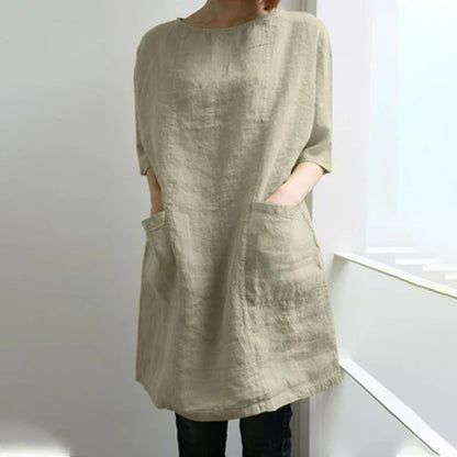 A cotton and linen dress with a round neckline, pockets, and an A-line silhouette in various colors.