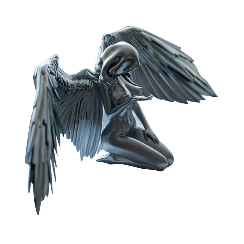 A silver resin ornament featuring the graceful silhouette of angel wings, perfect for adding a touch of Kiwi charm to your home decor.