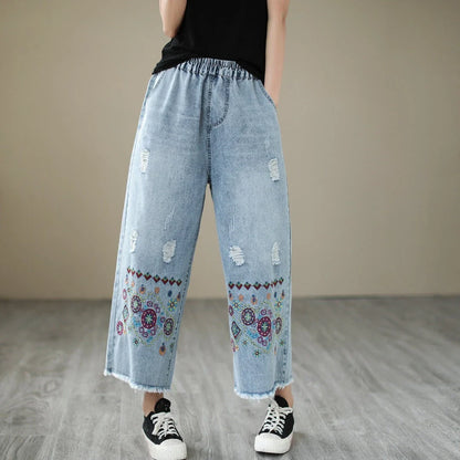 Embroidered denim jeans with distressed details, perfect for the modern Kiwi lifestyle