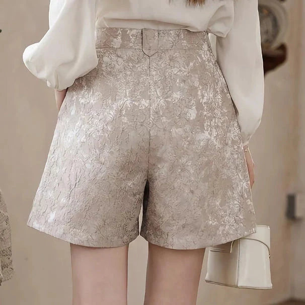 Elegant floral jacquard a-line shorts with metal buttons in apricot color