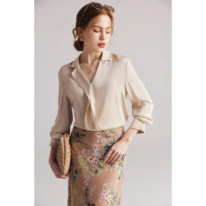 Elegant ruffled silk blouse in champagne color with V-neck design, suitable for professional or casual wear