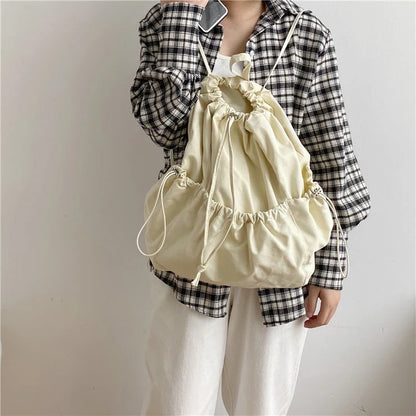 A stylish drawstring bucket bag made of premium polyester fabric, available in a variety of on-trend colours to complement your New Zealand fashion