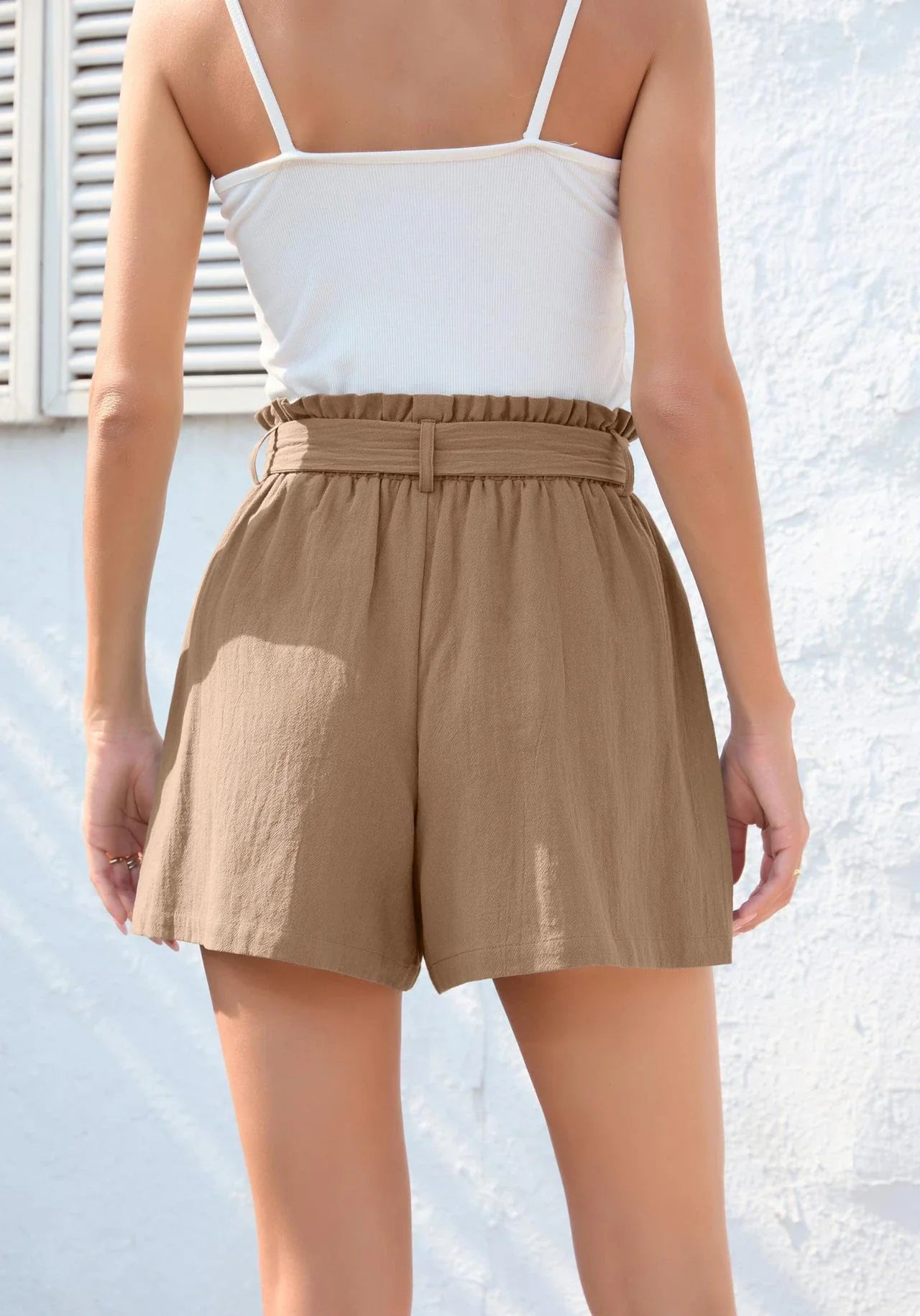 Stylish high-waisted ruffle bow shorts in black, perfect for Kiwi summer beach and casual wear