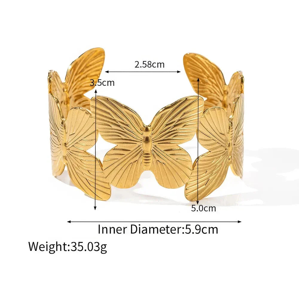 Stylish stainless steel bracelet with a butterfly design, featuring a luxurious 18K gold plating for a chic and sophisticated look.