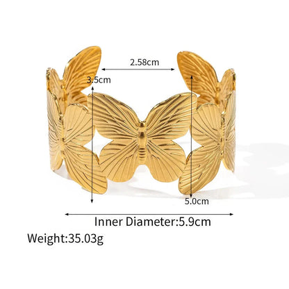 Stylish stainless steel bracelet with a butterfly design, featuring a luxurious 18K gold plating for a chic and sophisticated look.