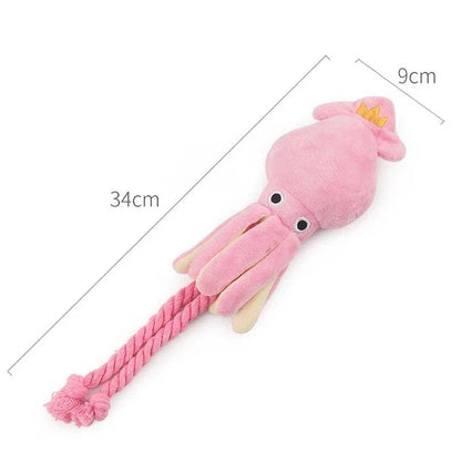 Cuddly pink squid-shaped plush toy for dogs, made of soft fleece material for snuggles and play