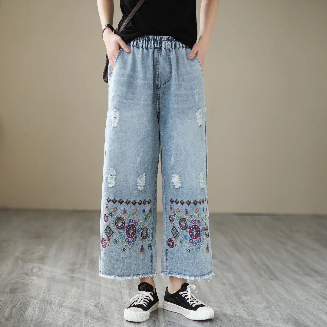 Embroidered denim jeans with distressed details, perfect for the modern Kiwi lifestyle