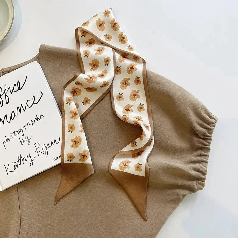 A high-quality silk scarf hair band in a versatile khaki nude color, perfect for adding elegance to any Kiwi outfit.