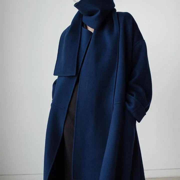 Stylish and warm New Zealand women's woollen coat in blue, featuring a chic scarf collar and relaxed fit design.