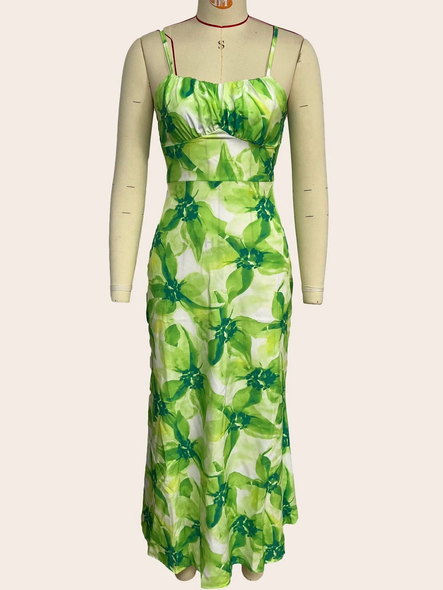 Stylish sleeveless backless midi dress with a vibrant floral print, perfect for any occasion