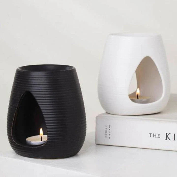 Elegant porcelain aroma diffuser in white and black colours, perfect for creating a relaxing atmosphere in your New Zealand home