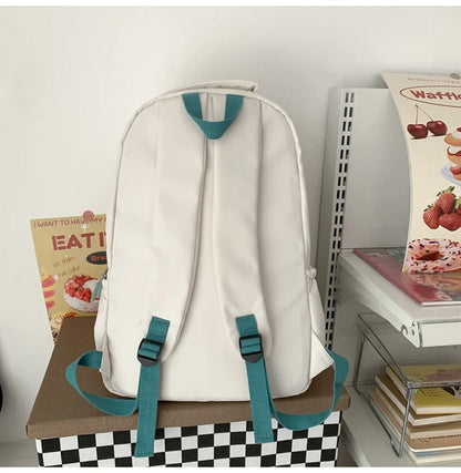 A stylish Japanese-inspired cat backpack with a large capacity, breathable nylon construction, and dedicated storage compartments for student essentials.