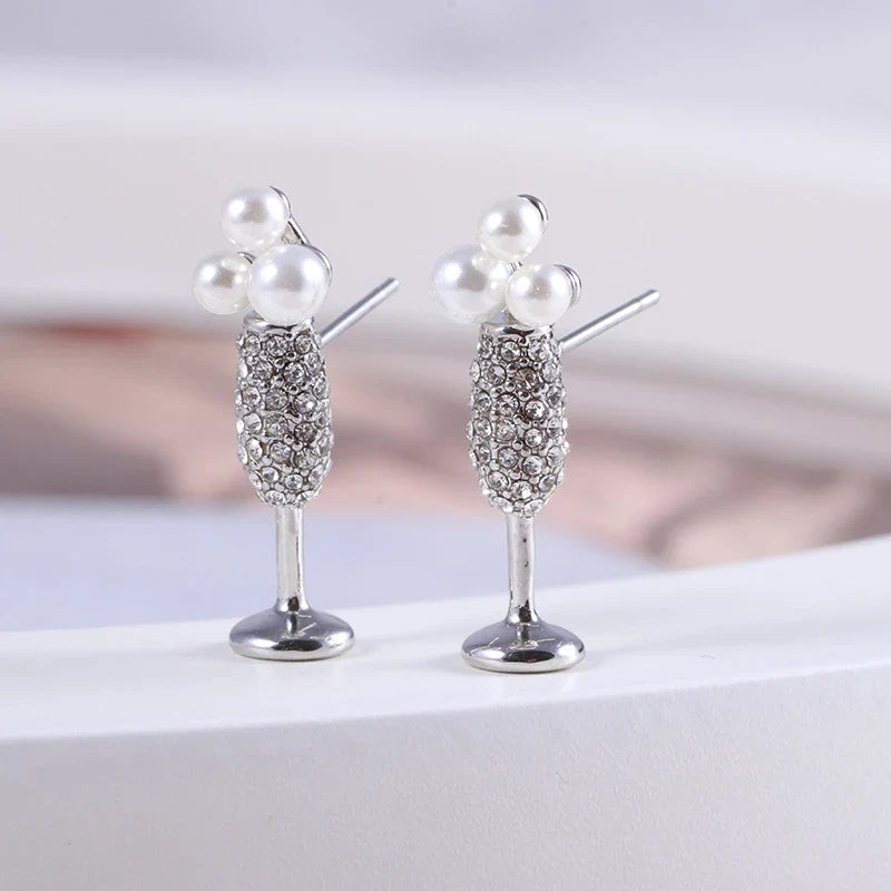 Stunning silver-plated earrings featuring a pearl inlay design, perfect for adding a touch of elegance to any outfit.