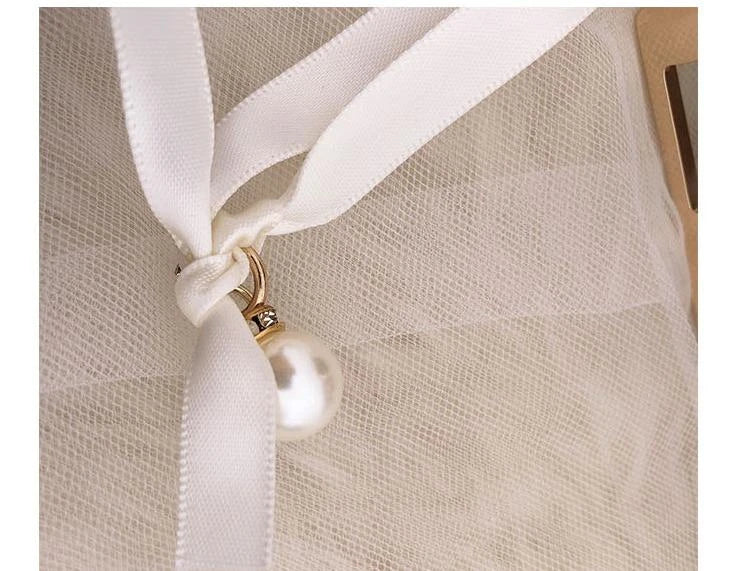 A stylish Kiwi-designed diamond-studded dinner bag with metallic accents, showcasing a range of premium features like lace, plaid, and sequins.