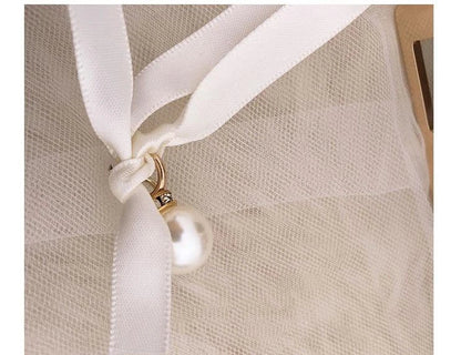 A stylish Kiwi-designed diamond-studded dinner bag with metallic accents, showcasing a range of premium features like lace, plaid, and sequins.