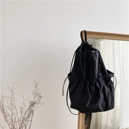 A stylish drawstring bucket bag made of premium polyester fabric, available in a variety of on-trend colours to complement your New Zealand fashion