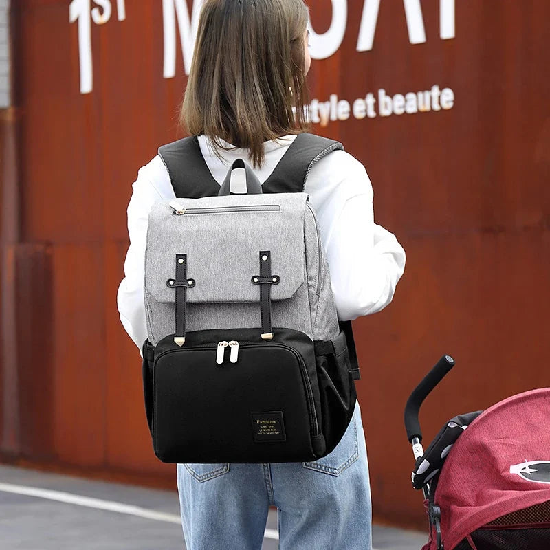 Versatile Mummy Daddy Backpack in Grey, a functional and stylish nappy bag for Kiwi families with a spacious main compartment, insulated pockets, and a USB charging port.