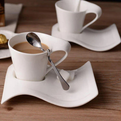 Stylish wavy ceramic coffee mug with matching saucer, available in various sizes and materials, designed in New Zealand for an elevated coffee experience.