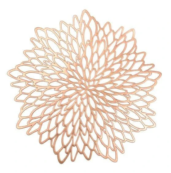 Flower-shaped PVC placemat in gold color, adding natural beauty and elegance to a dining table setting.