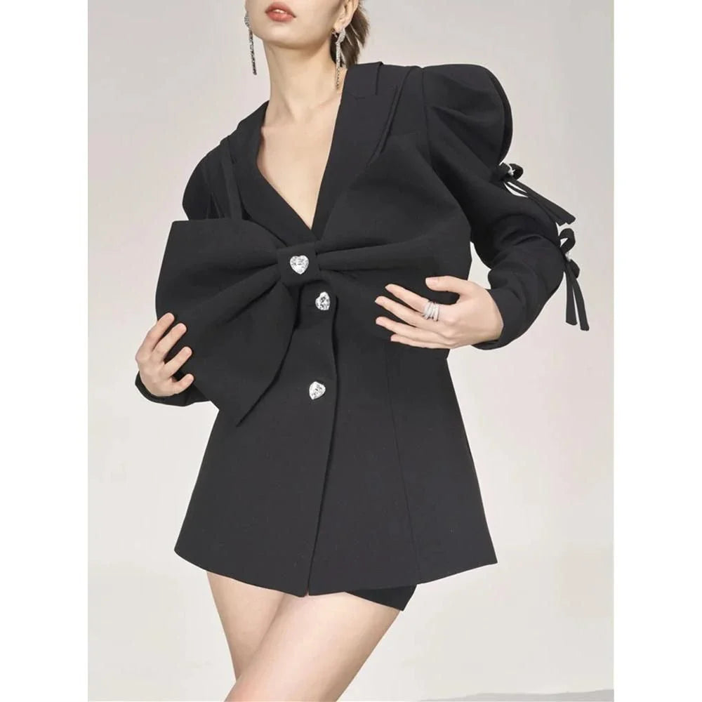 A stylish women's blazer in black with a unique diamond bow detail, perfect for elevating your fashion in New Zealand