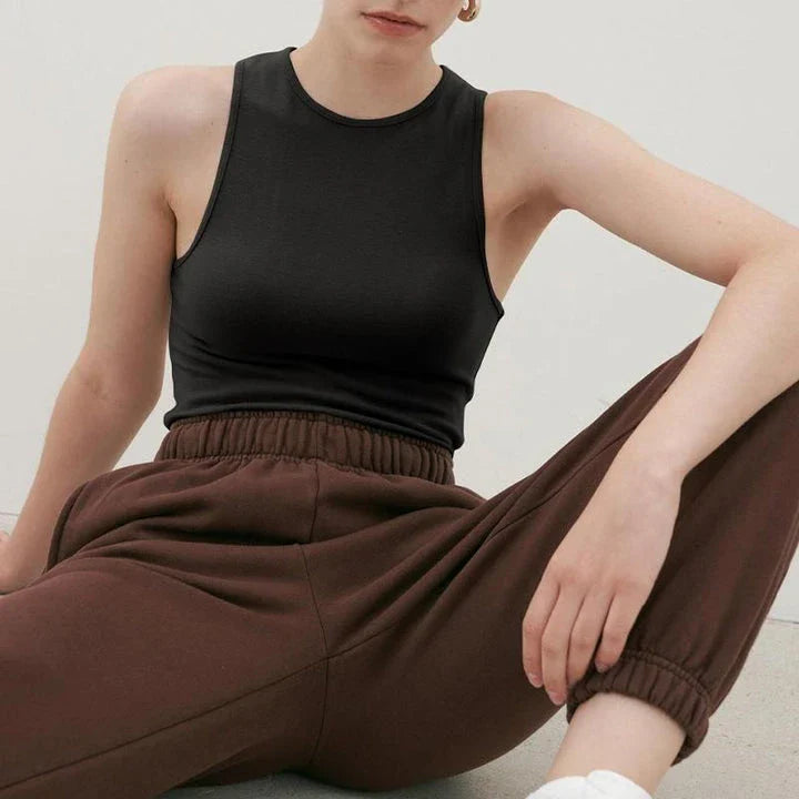 Stylish summer bodycon tank top for Kiwi women, featuring a comfortable and flattering design in a classic beige color.