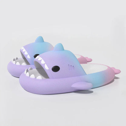 Gradient rainbow shark-patterned slippers with a comfortable EVA sole and durable PVC upper, available in a range of vibrant colours