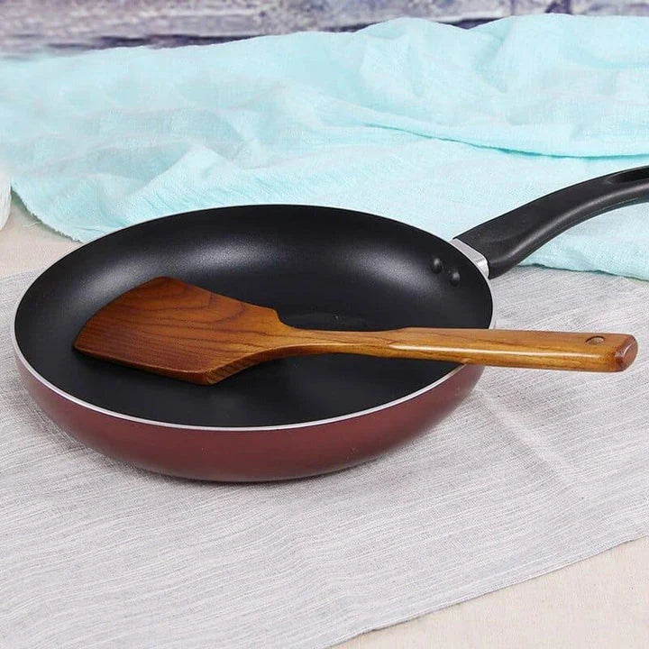 Versatile Wooden Turner - a high-quality, long-handled kitchen tool made from sustainable New Zealand timber for flipping, tossing, and maneuvering food with ease.