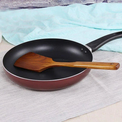 Versatile Wooden Turner - a high-quality, long-handled kitchen tool made from sustainable New Zealand timber for flipping, tossing, and maneuvering food with ease.
