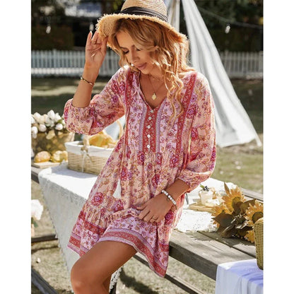 Stylish bohemian mini dress with geometric print, featuring a v-neck, three-quarter sleeves, and a flattering A-line silhouette.