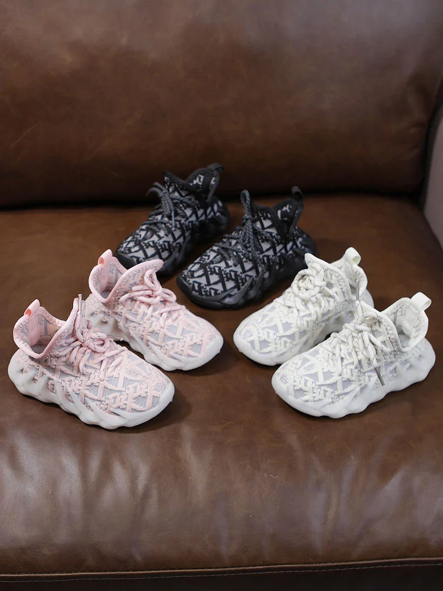 Breathable mesh sports shoes in beige, black, and pink colours for active Kiwi children