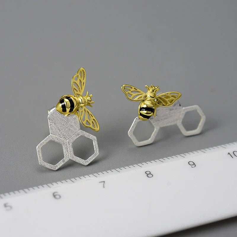 Handcrafted sterling silver beehive ear studs with a unique design inspired by nature's hard workers