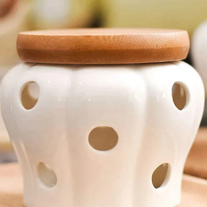 Stylish white ceramic garlic storage jar with wooden lid, designed for modern Kiwi kitchens