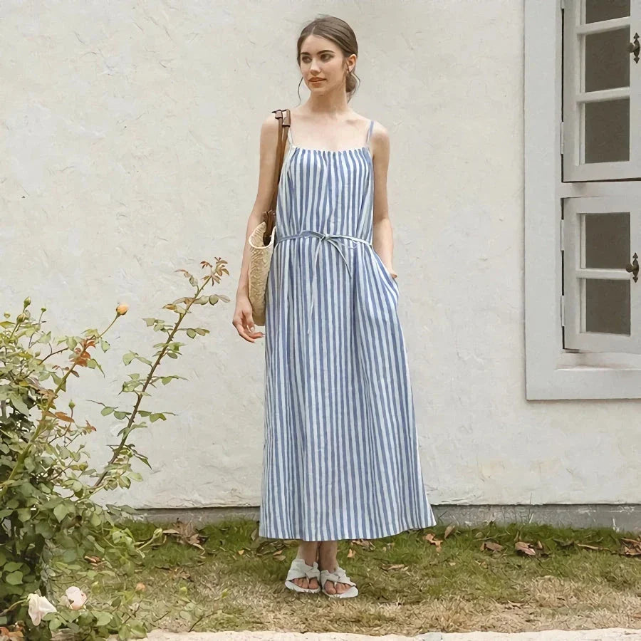 A stylish striped cotton linen maxi dress with an elegant A-line silhouette, perfect for summer in New Zealand.