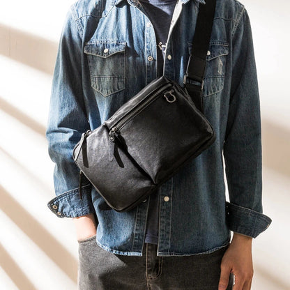 Stylish New Zealand-made leather shoulder bag in black for men, featuring a spacious design and adjustable strap for everyday use.