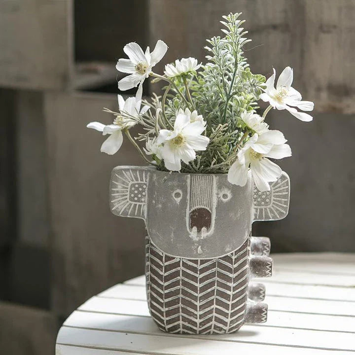 Charming kiwi-inspired koala-shaped cement planter for displaying succulents, small flowers, or as a decorative piece