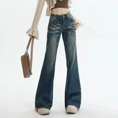 Pair of high-waisted flare jeans in a vintage wash, featuring functional details like tassels and buttons for a stylish, Kiwi-inspired look.