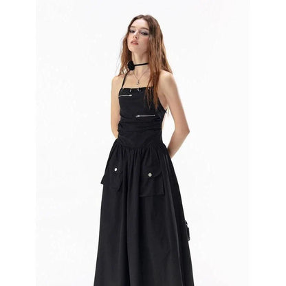 Elegant black backless maxi dress with pockets, perfect for formal events or casual outings.