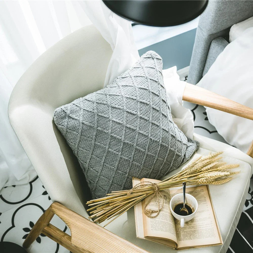 Elegant grey knitted decorative pillow case with intricate jacquard pattern and embroidered stripes