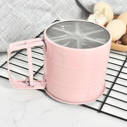 Elegant macaron pink handheld flour sifter with stainless steel construction, perfect for Kiwi bakers