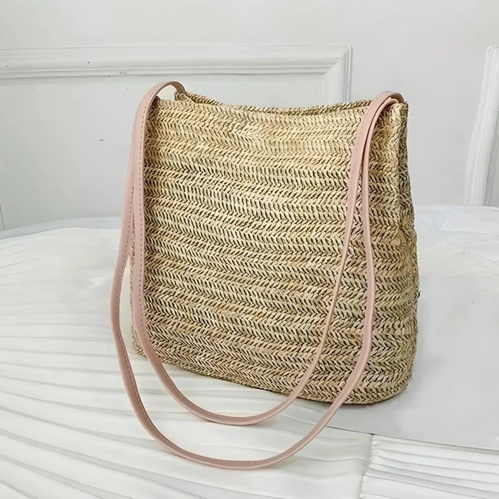 Bohemian straw woven shoulder bag in beige color, featuring a secure hasp closure and a lightweight, durable design for summer adventures.