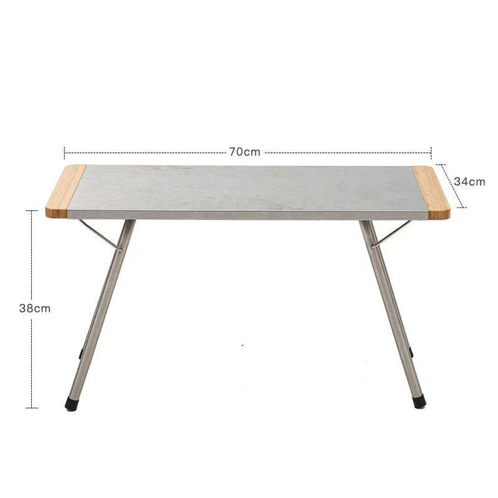 Portable bamboo folding table with stainless steel frame, ideal for outdoor activities like camping, picnics, and BBQs in New Zealand