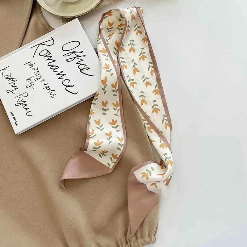 A high-quality silk scarf hair band in a versatile khaki nude color, perfect for adding elegance to any Kiwi outfit.