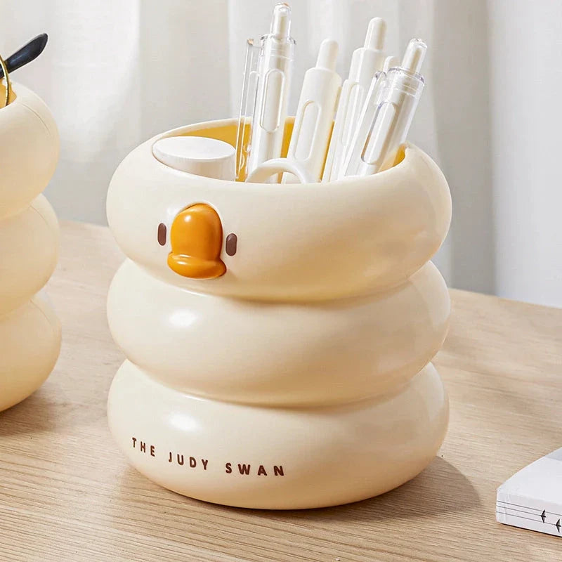 Adorable cartoon-style plastic pen holder with a large capacity for storing pens, pencils, and other desk essentials