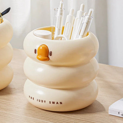 Adorable cartoon-style plastic pen holder with a large capacity for storing pens, pencils, and other desk essentials