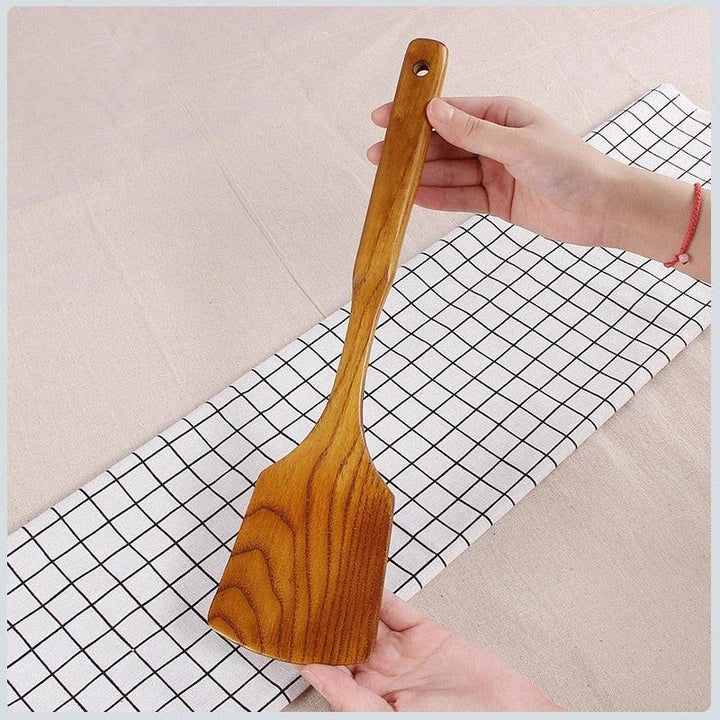 Versatile Wooden Turner - a high-quality, long-handled kitchen tool made from sustainable New Zealand timber for flipping, tossing, and maneuvering food with ease.
