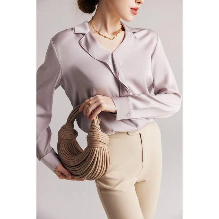 Elegant ruffled silk blouse in champagne color with V-neck design, suitable for professional or casual wear