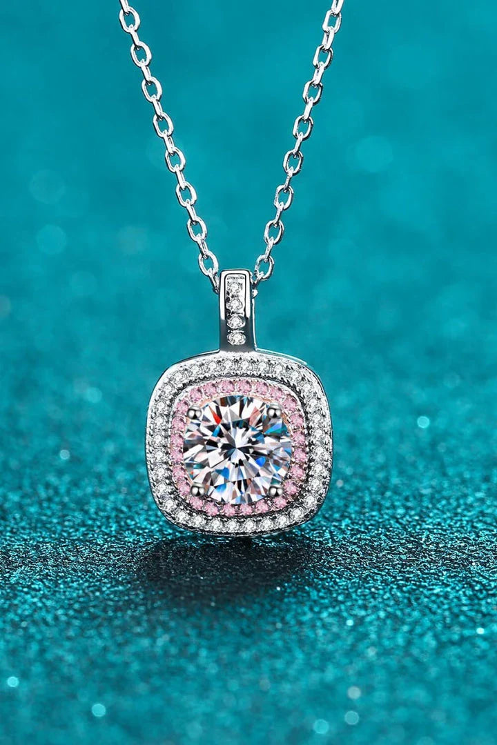 A sterling silver geometric pendant necklace featuring a radiant Moissanite centre stone and accented with shimmering zircon stones